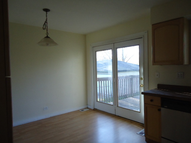 343 Gehrig Circle Bolingbrook, IL 60440 - Photo 8 of 16 an empty room with wooden floor and windows
