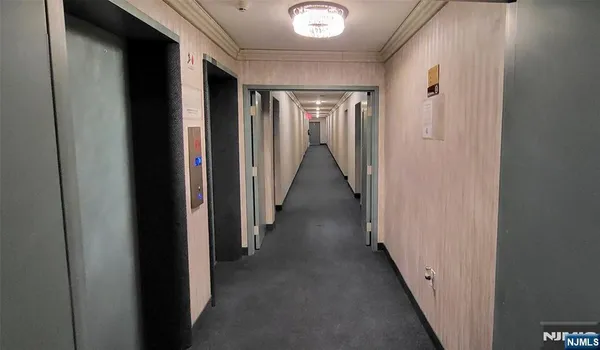 a kitchen with kitchen island granite countertop lots of counter top space and stainless steel appliances