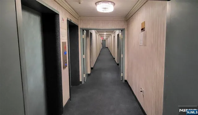 a kitchen with kitchen island granite countertop lots of counter top space and stainless steel appliances