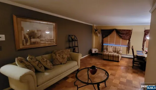 a view of a livingroom with furniture and a window