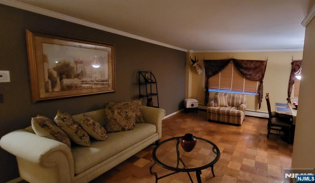 44 Main Street, Unit 6F Lodi, NJ 07644 - Photo 8 of 14 a living room with furniture and a flat screen tv