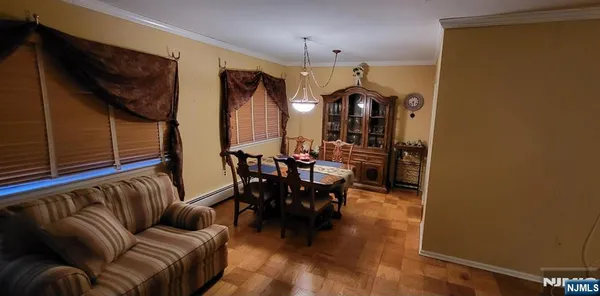 a view of hallway with furniture and a window