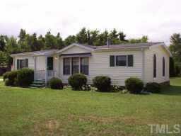 744 Providence Road Roxboro, NC 27573 - Photo 1 of 1 a view of a house with a yard and plants