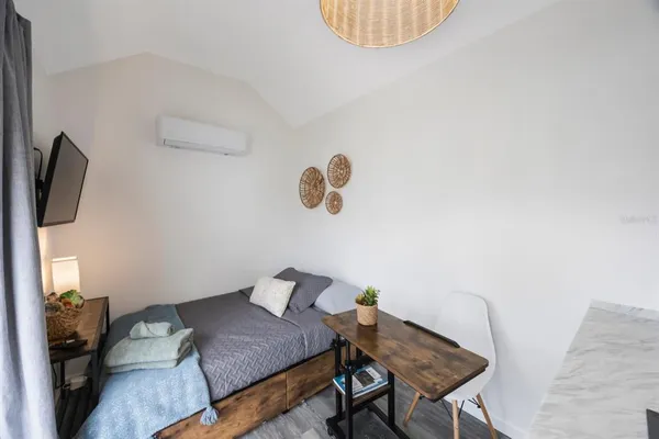 a kitchen with stainless steel appliances a sink cabinets and a window