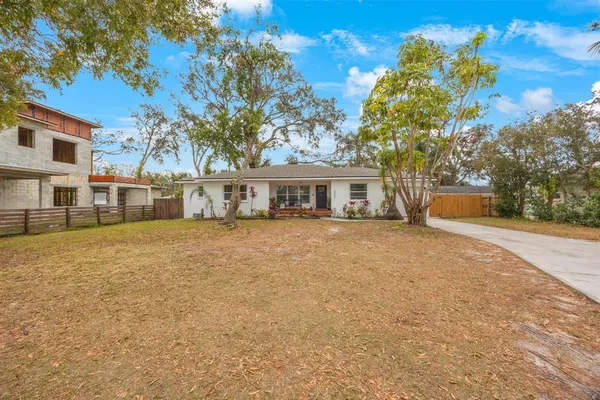 a house with trees in front of it