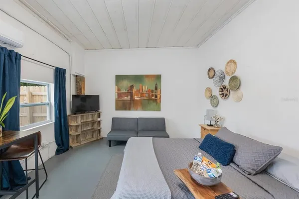 a bed room with a bed and cabinets