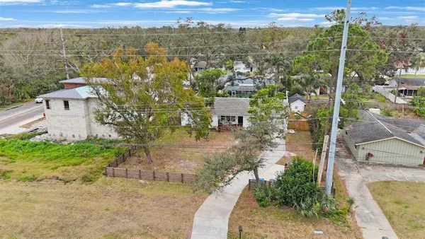 an aerial view of a house with outdoor space