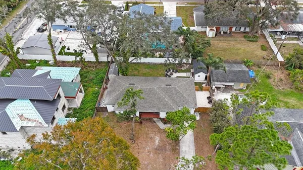 a aerial view of a house with a yard and garden