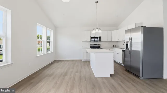 a view of a kitchen and a window