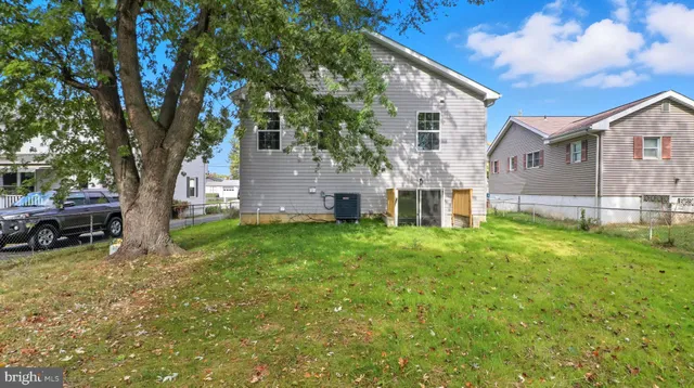 a view of a house with a back yard