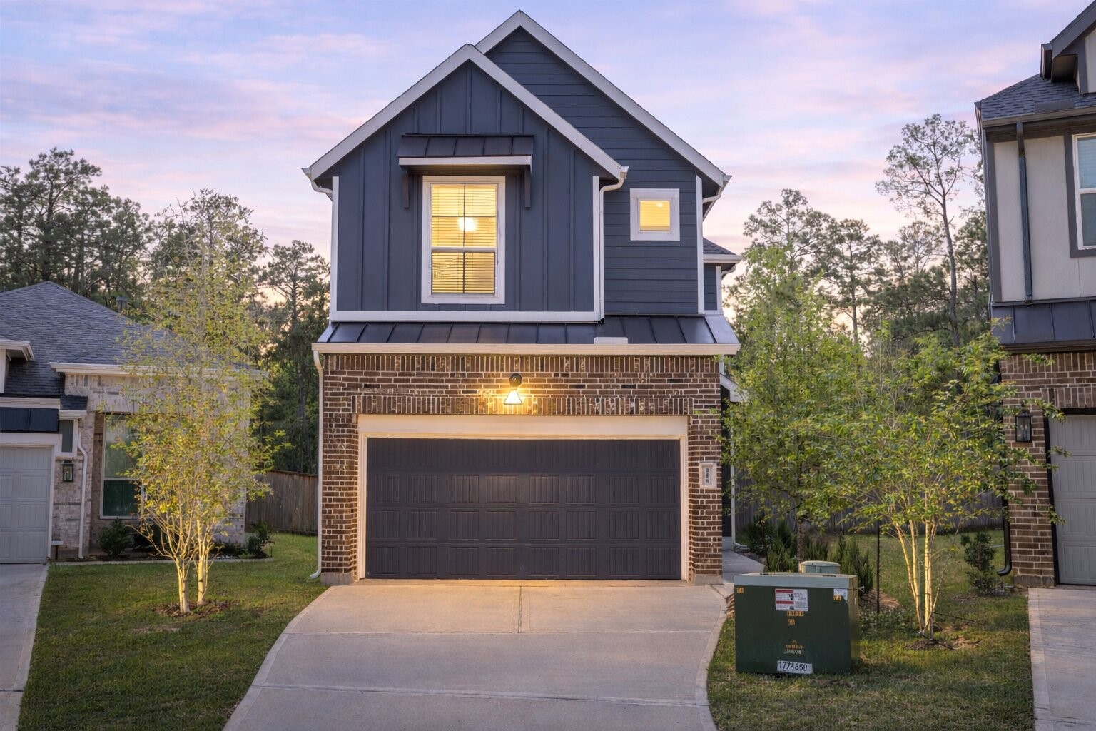 219 Prairie Rose Court Conroe, TX 77318 - Photo 1 of 49 a front view of a house with a yard and garage