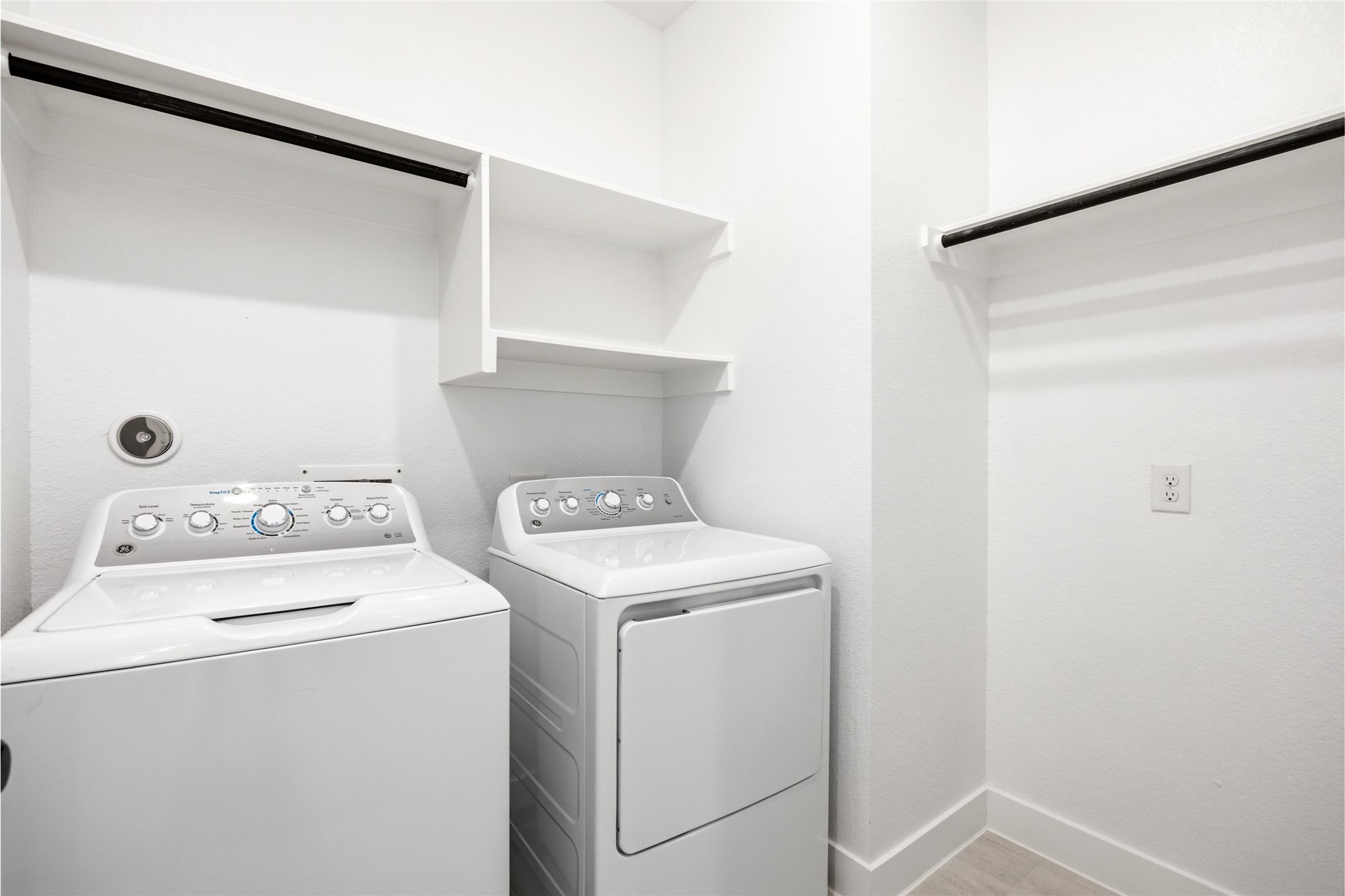 219 Prairie Rose Court Conroe, TX 77318 - Photo 17 of 49 a utility room with dryer and washer