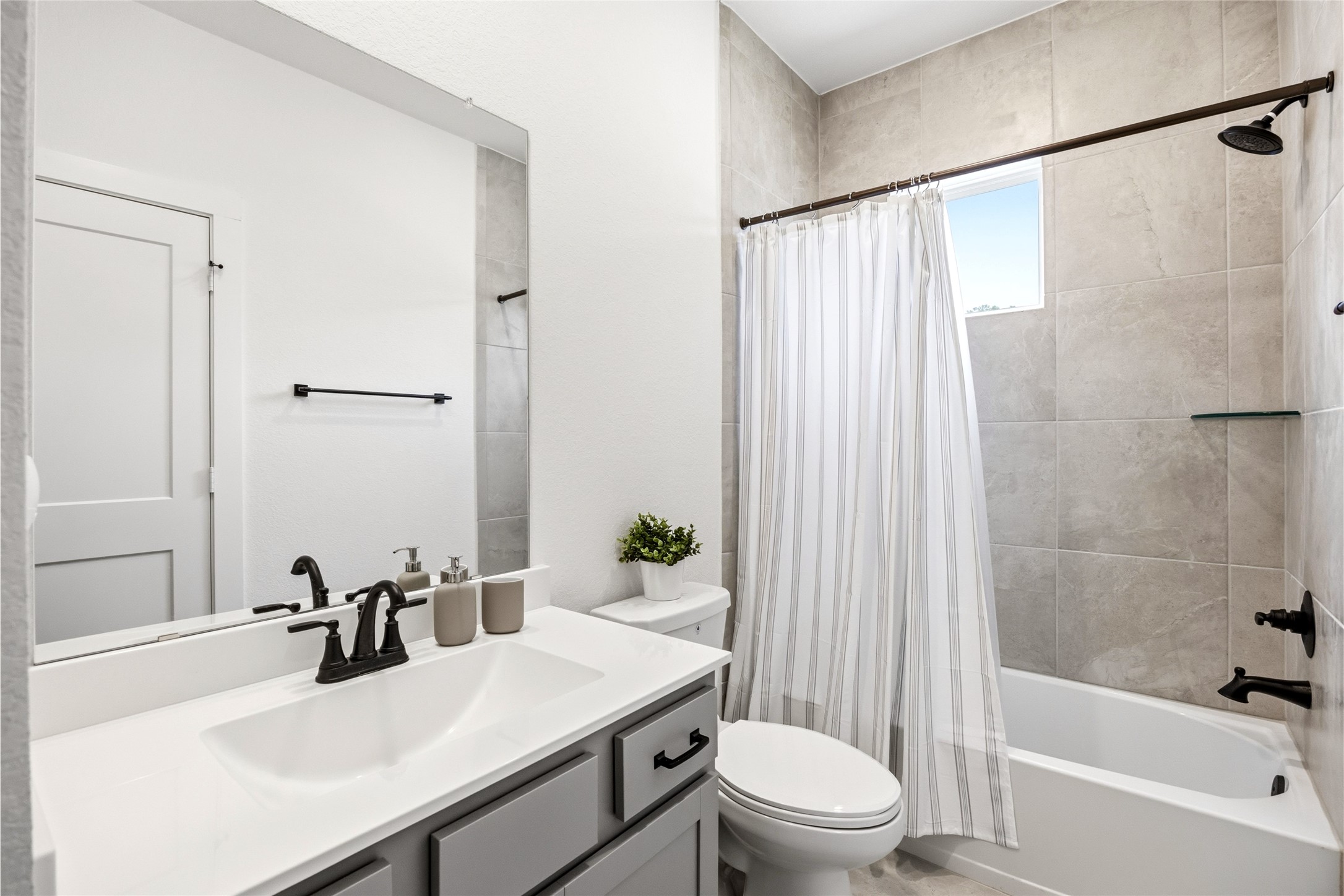 219 Prairie Rose Court Conroe, TX 77318 - Photo 23 of 49 a bathroom with a sink a toilet and shower