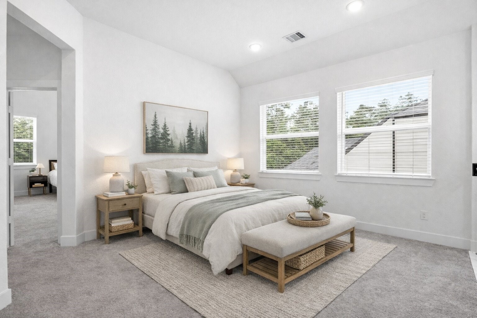 219 Prairie Rose Court Conroe, TX 77318 - Photo 24 of 49 a spacious bedroom with a bed and large windows