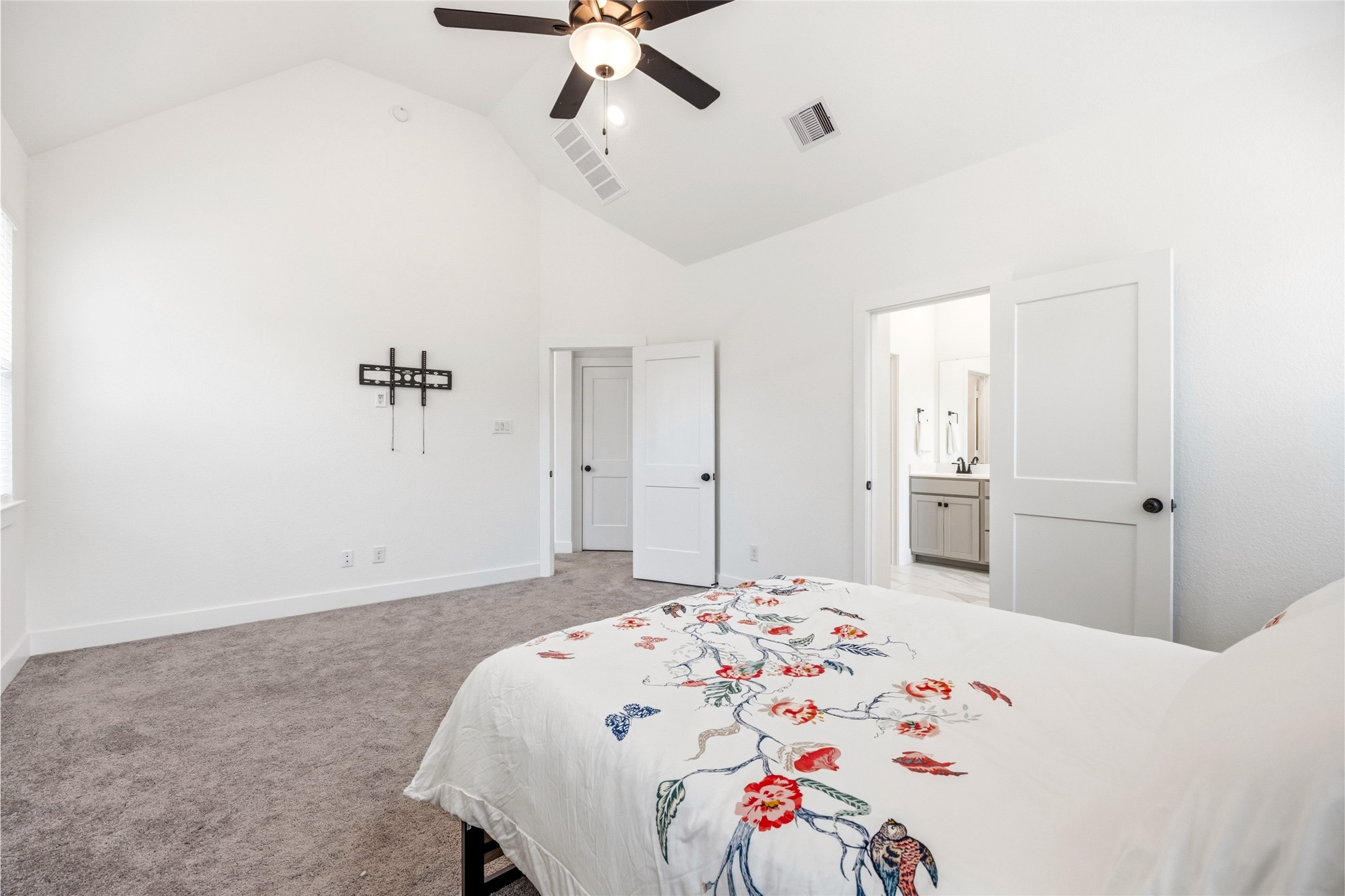 219 Prairie Rose Court Conroe, TX 77318 - Photo 29 of 49 a bedroom with a bed and a dresser