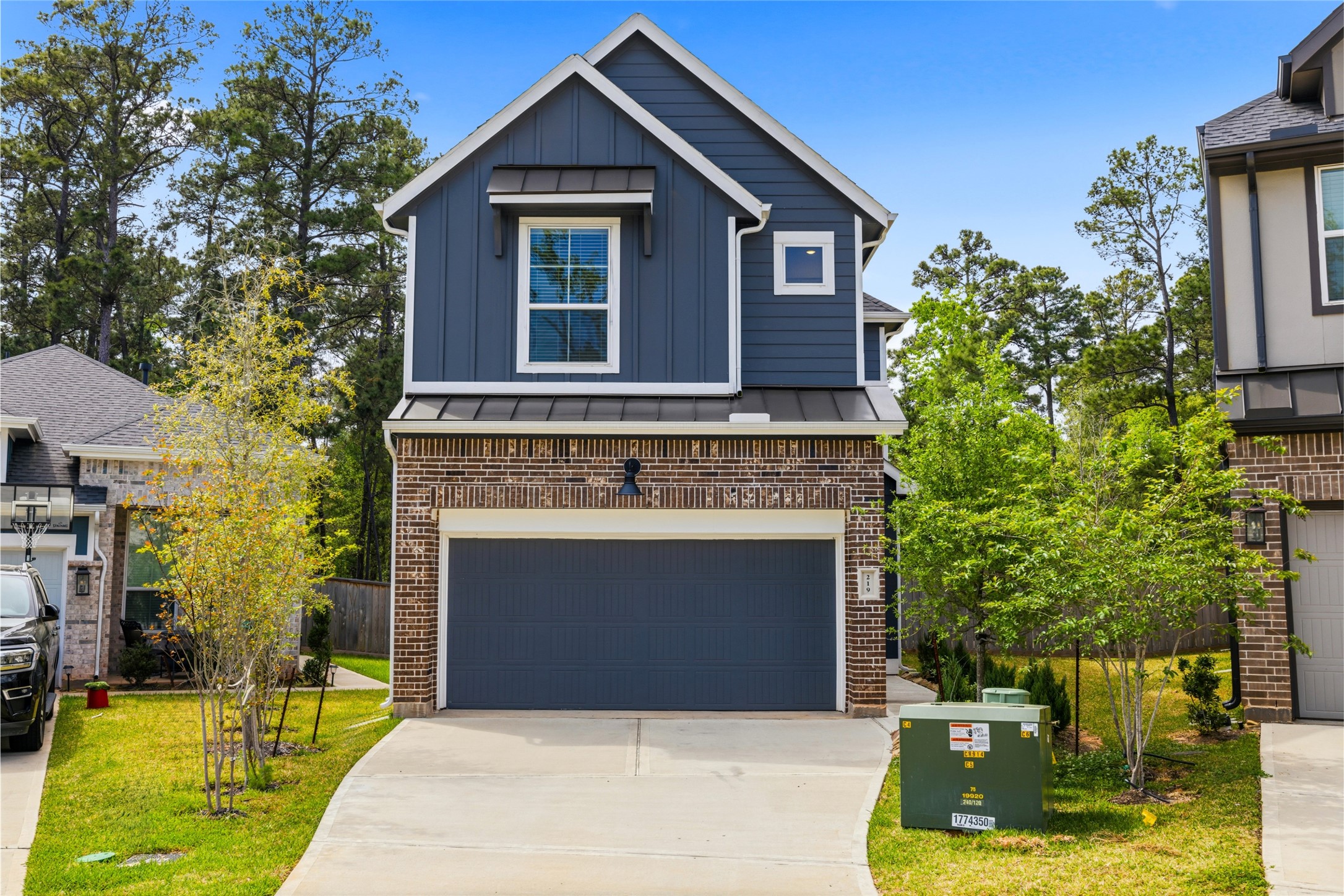 219 Prairie Rose Court Conroe, TX 77318 - Photo 49 of 49 a front view of a house with a yard