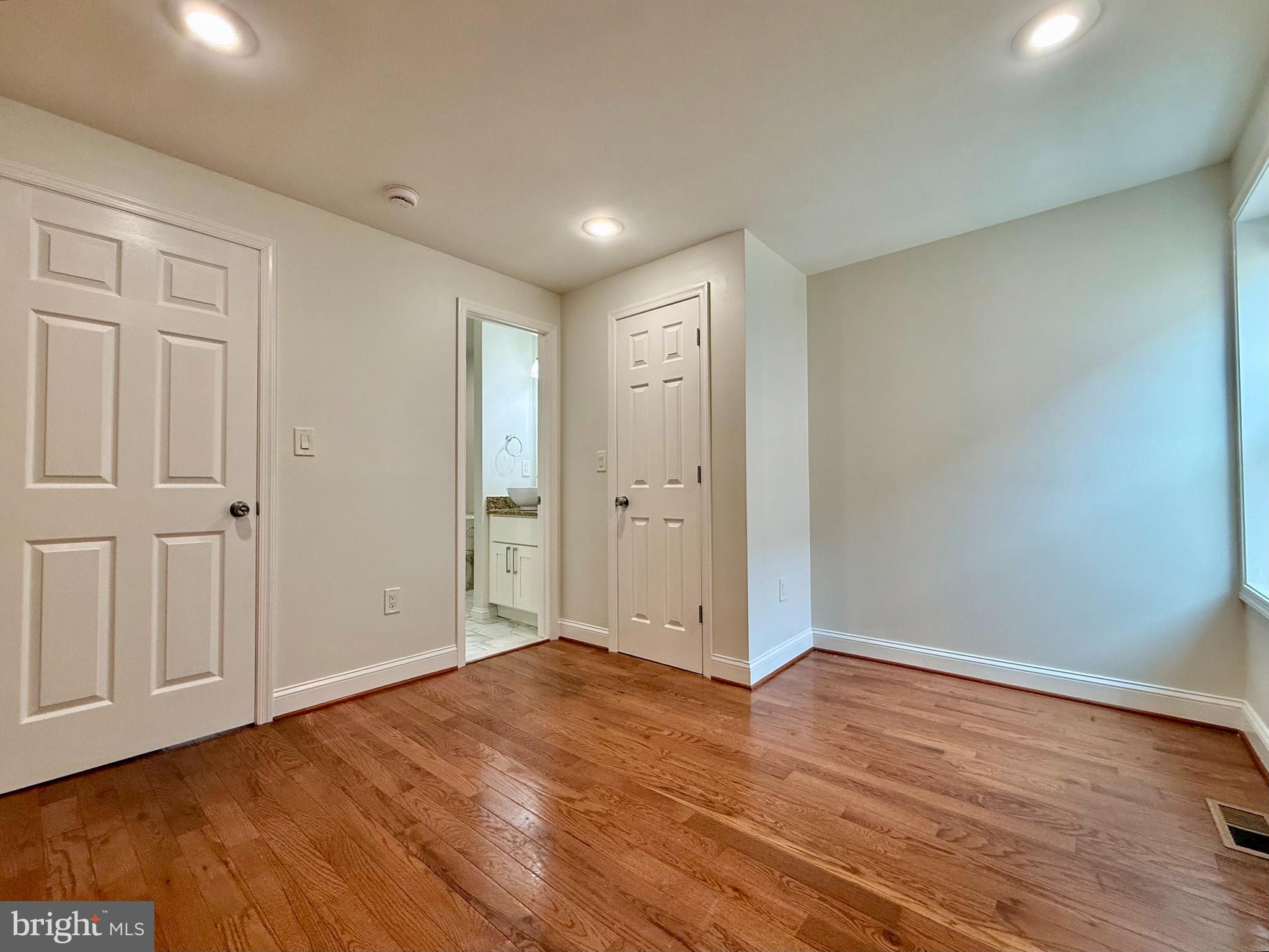 1268 Glyndon Avenue Baltimore, MD 21223 - Photo 14 of 30 a view of an empty room with wooden floor