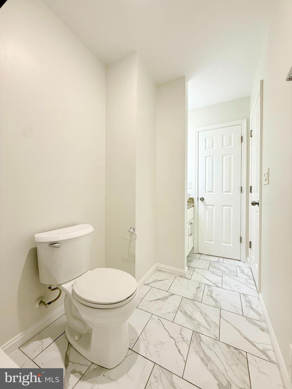 1268 Glyndon Avenue Baltimore, MD 21223 - Photo 16 of 30 a bathroom with a toilet and a shower