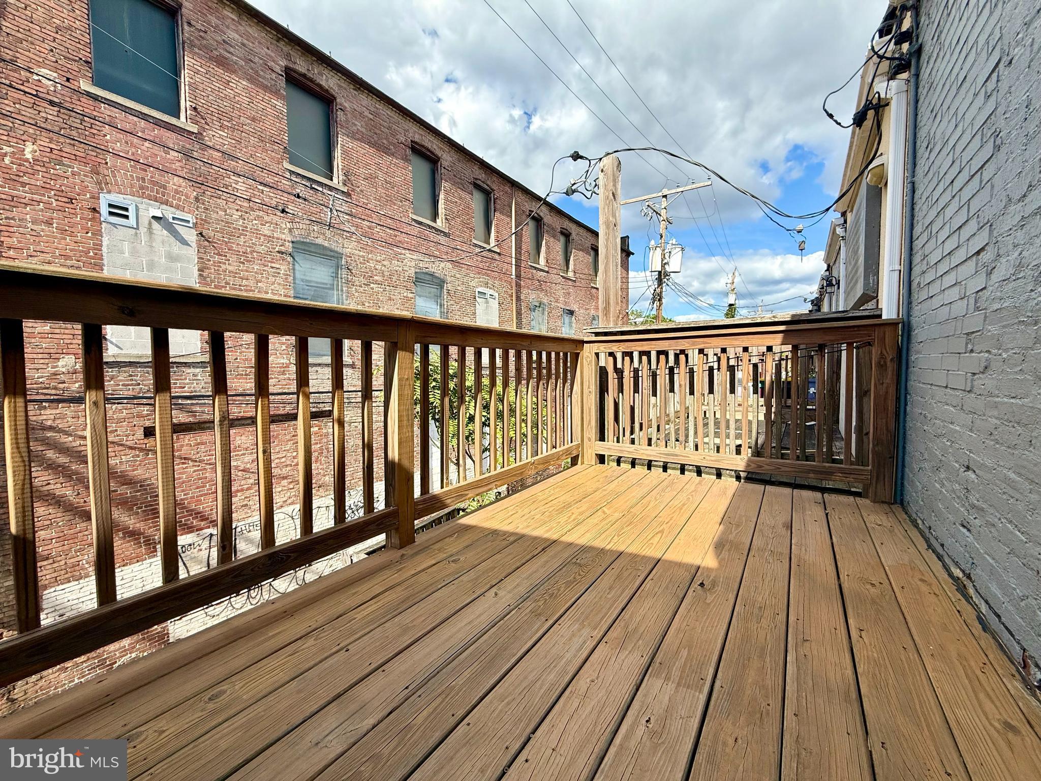 1268 Glyndon Avenue Baltimore, MD 21223 - Photo 18 of 30 a view of wooden balcony with a bench
