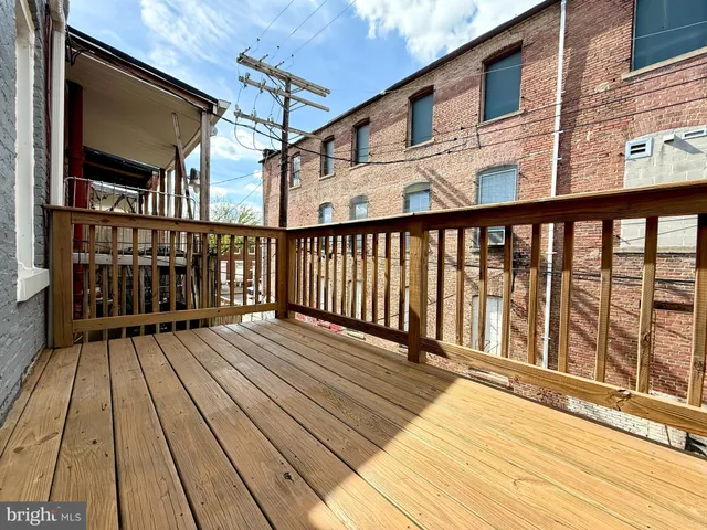 a view of wooden balcony with wooden floor