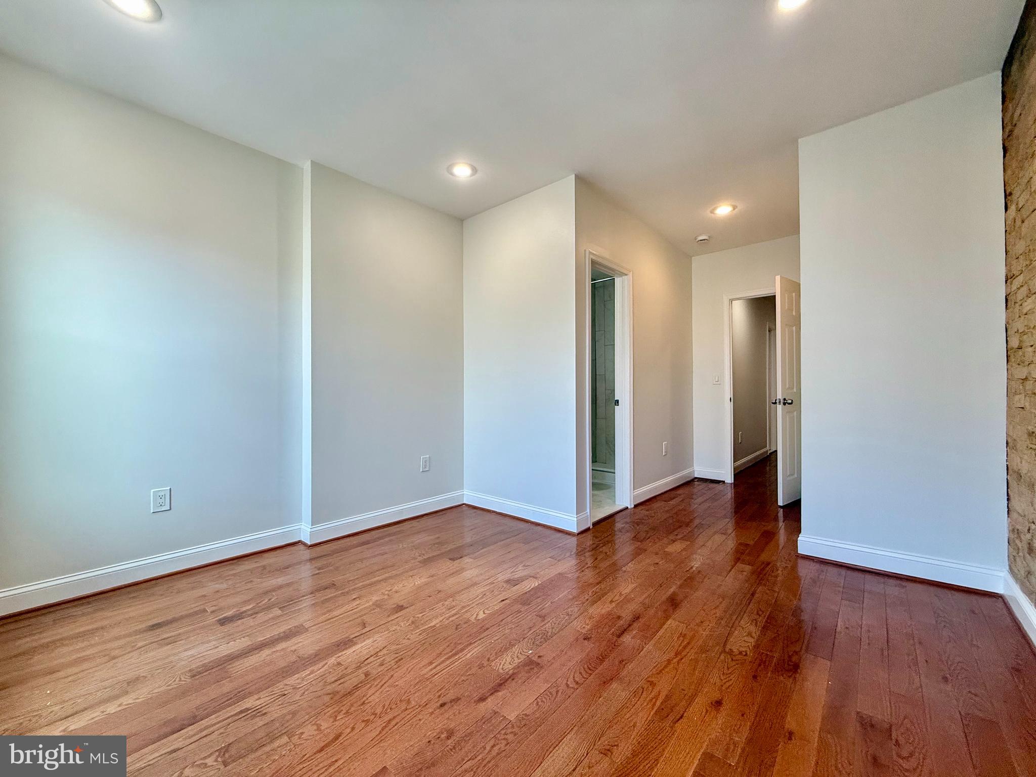 1268 Glyndon Avenue Baltimore, MD 21223 - Photo 21 of 30 a view of an empty room with wooden floor