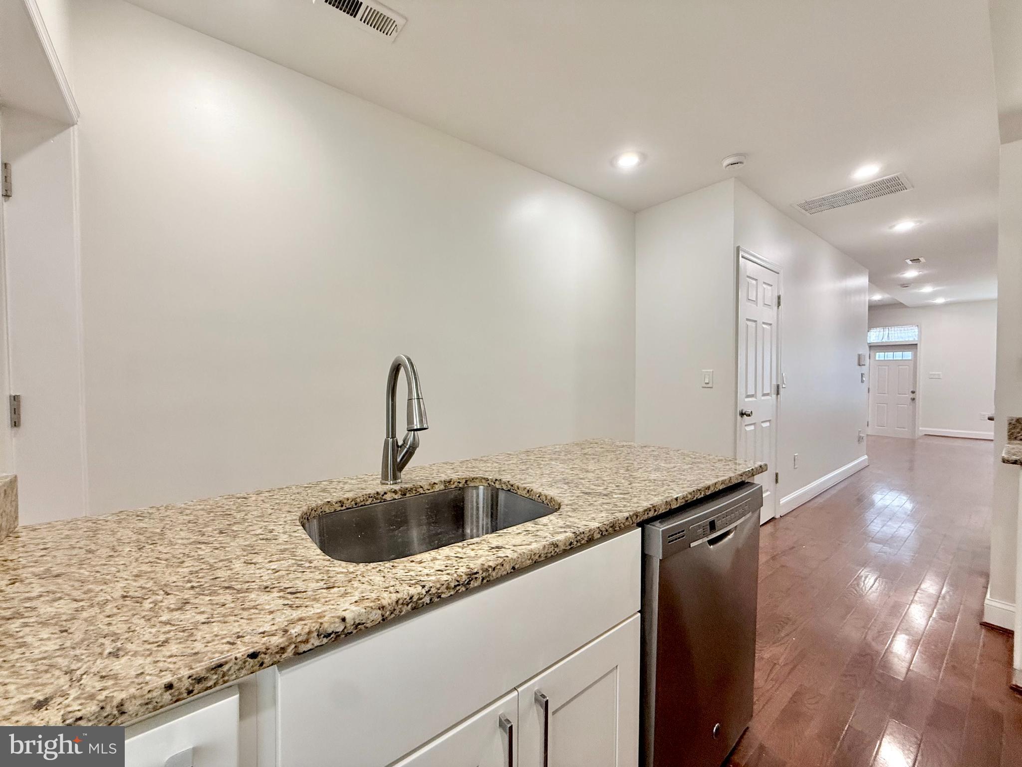 1268 Glyndon Avenue Baltimore, MD 21223 - Photo 9 of 30 a kitchen with a sink and cabinets