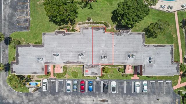 a view of a chairs and table in a backyard