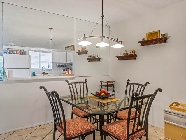 a view of a dining room with furniture wooden floor and chandelier