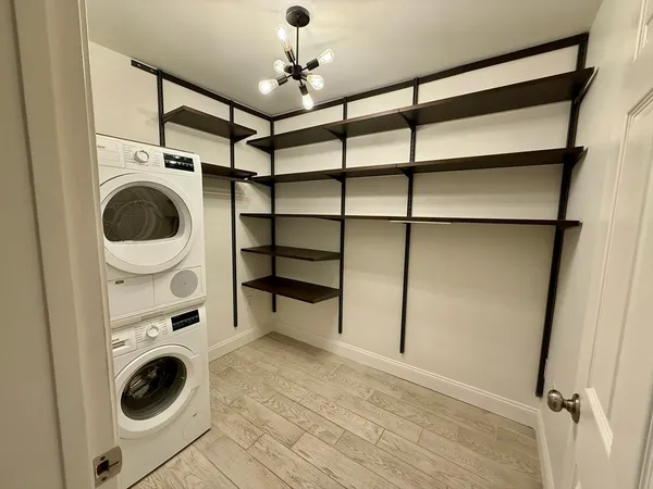 a view of a storage & utility room with washer and dryer