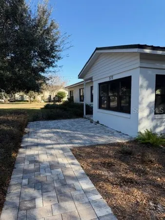 a view of a backyard of the house