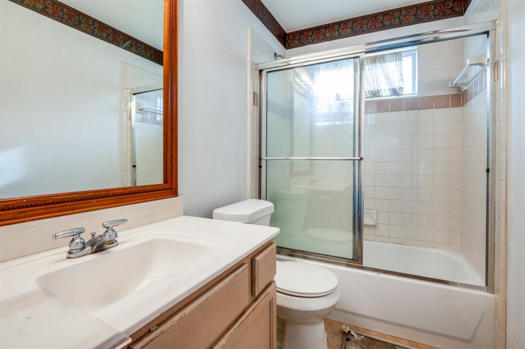 413 Majesty Drive Allen, TX 75013 - Photo 11 of 12 a bathroom with a sink toilet and shower