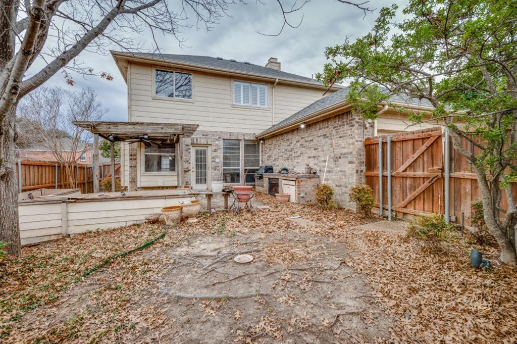 413 Majesty Drive Allen, TX 75013 - Photo 12 of 12 a view of a house with a large tree and wooden fence