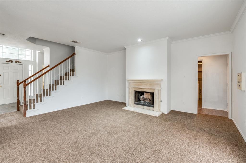 413 Majesty Drive Allen, TX 75013 - Photo 2 of 12 a view of an empty room with a fireplace