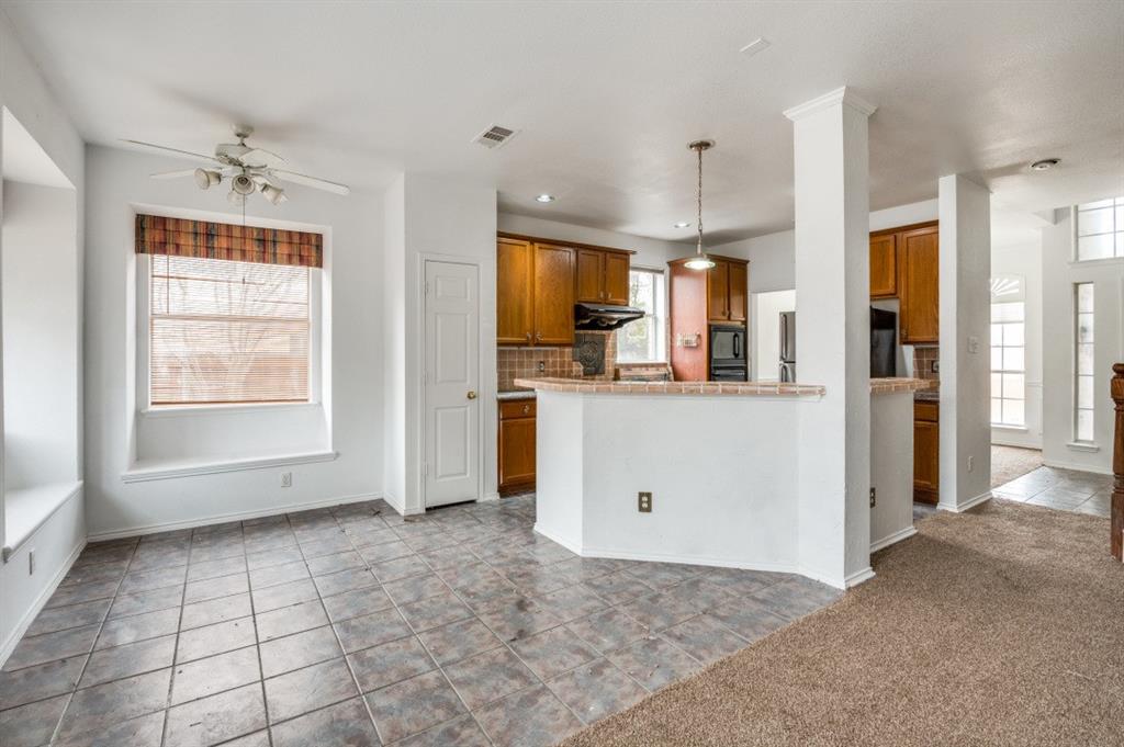 413 Majesty Drive Allen, TX 75013 - Photo 4 of 12 a view of kitchen with refrigerator and window