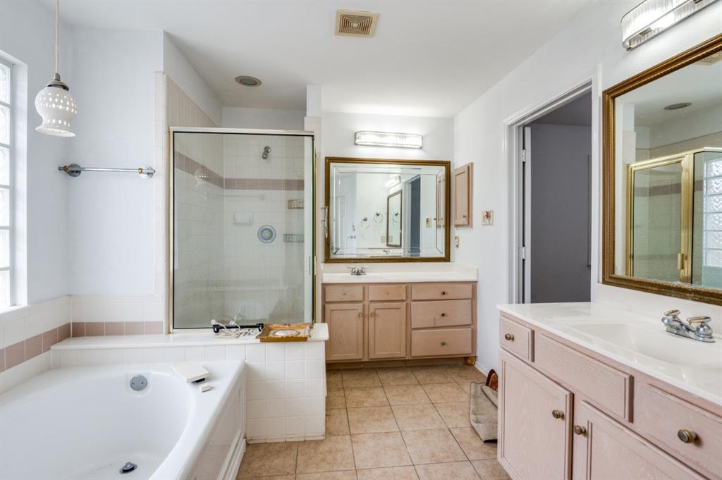 413 Majesty Drive Allen, TX 75013 - Photo 7 of 12 a bathroom with a granite countertop tub sink double vanity granite tub shower and mirror