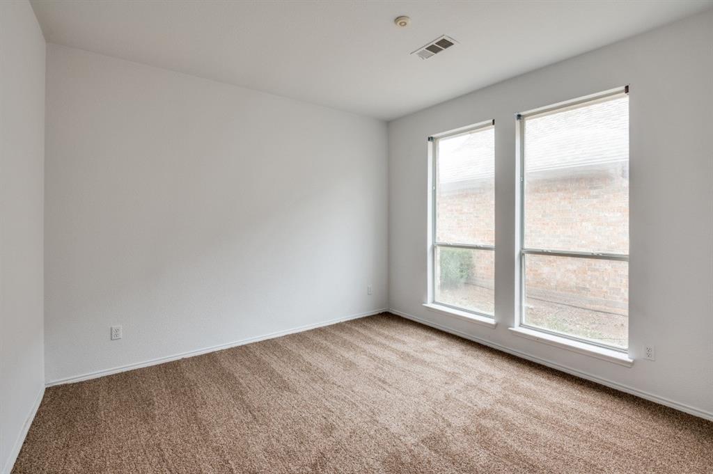 413 Majesty Drive Allen, TX 75013 - Photo 10 of 12 an empty room with a window