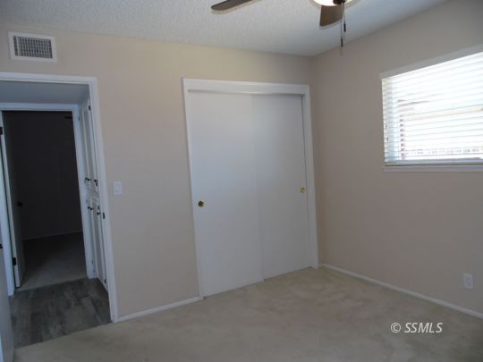208 South Greenlawn Street Ridgecrest, CA 93555 - Photo 17 of 29 an empty room with windows