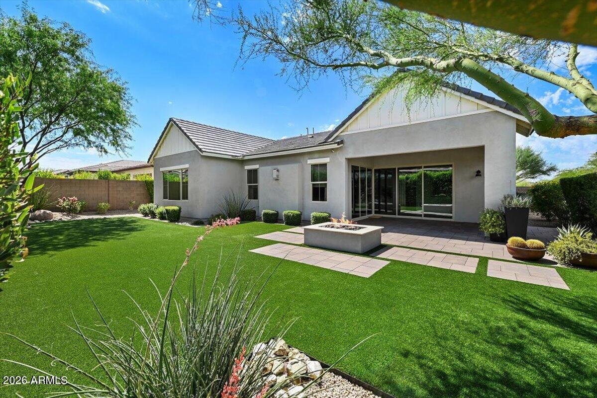 4412 East Roy Rogers Road Cave Creek, AZ 85331 - Photo 6 of 40 a view of a house with backyard sitting area and garden