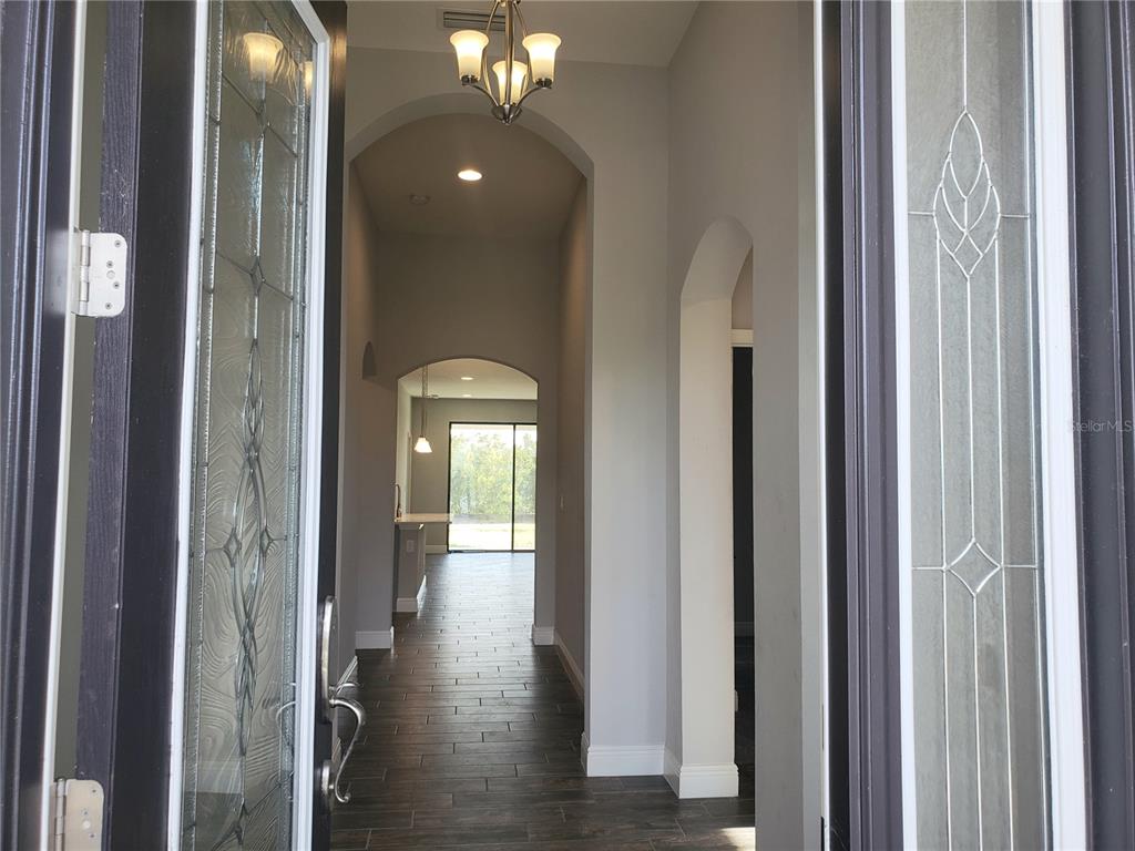 6206 Colmar Place Apollo Beach, FL 33572 - Photo 12 of 26 a view of a hallway with wooden floor
