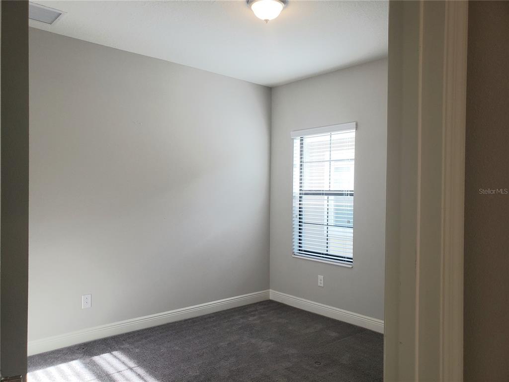 6206 Colmar Place Apollo Beach, FL 33572 - Photo 13 of 26 an empty room with windows