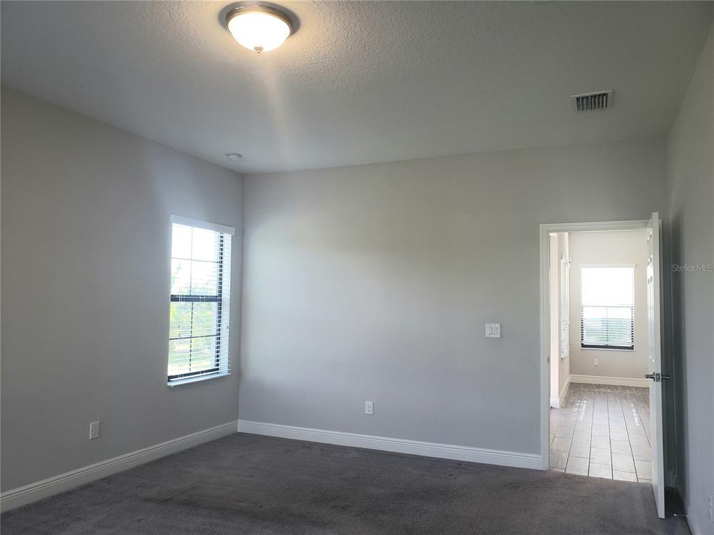 6206 Colmar Place Apollo Beach, FL 33572 - Photo 18 of 26 an empty room with windows and closet