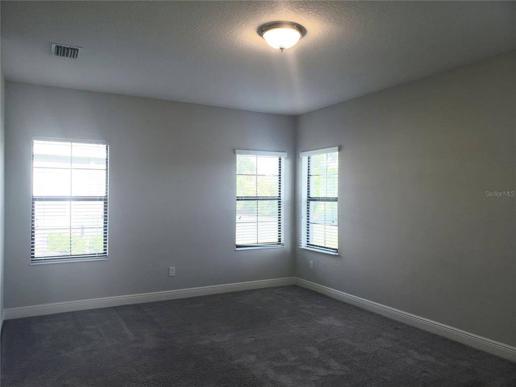 6206 Colmar Place Apollo Beach, FL 33572 - Photo 19 of 26 an empty room with windows
