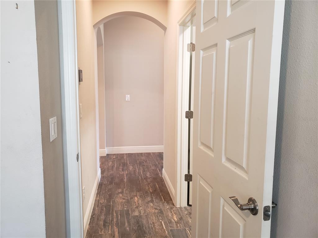 6206 Colmar Place Apollo Beach, FL 33572 - Photo 5 of 26 a view of a room with wooden floor