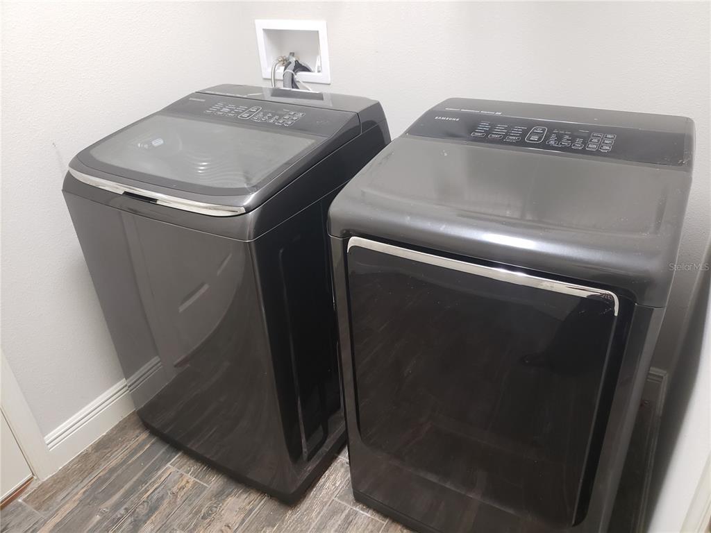 6206 Colmar Place Apollo Beach, FL 33572 - Photo 7 of 26 a utility room with dryer and washer