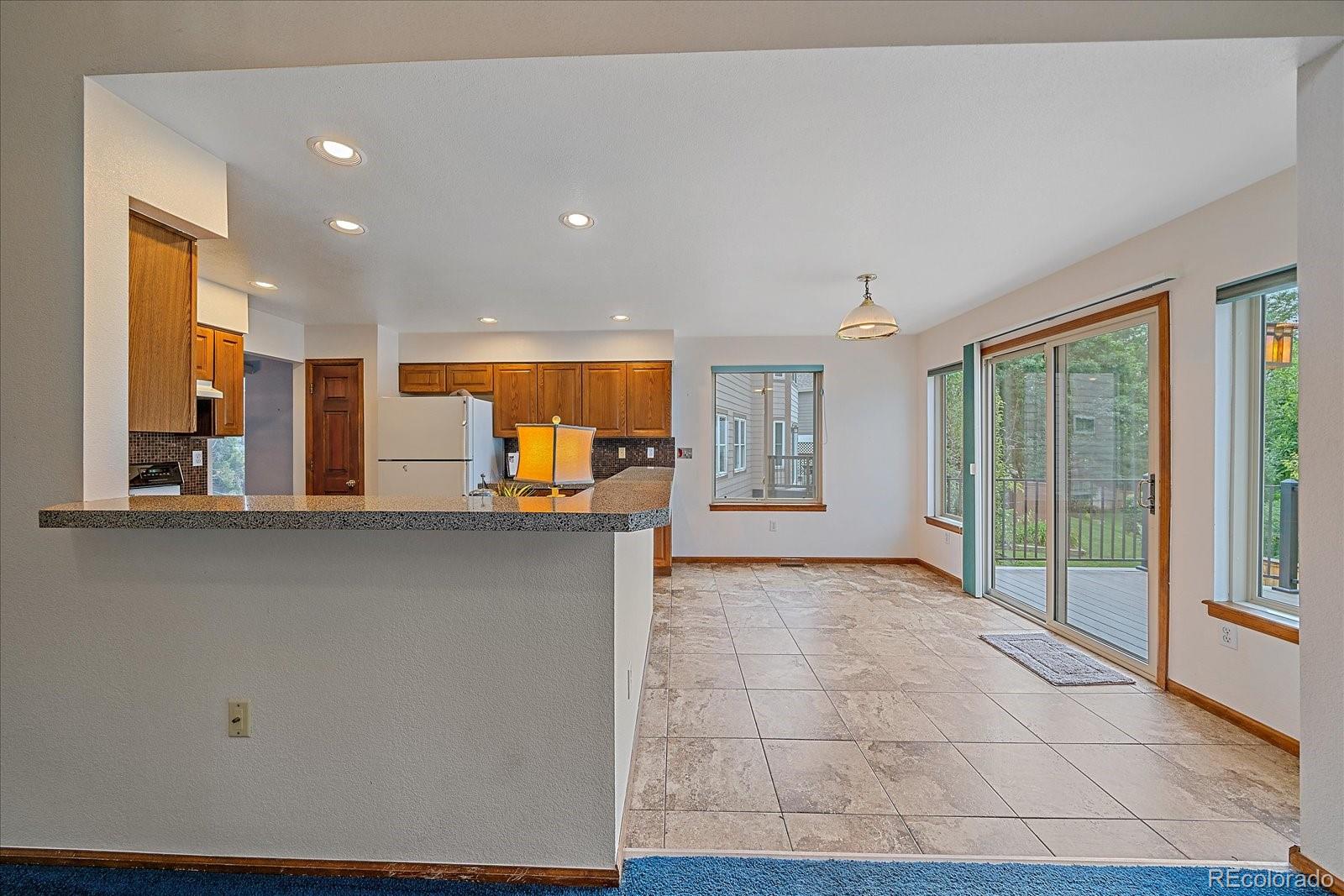9875 Spring Hill Street Highlands Ranch, CO 80129 - Photo 12 of 38 a view of a kitchen with windows