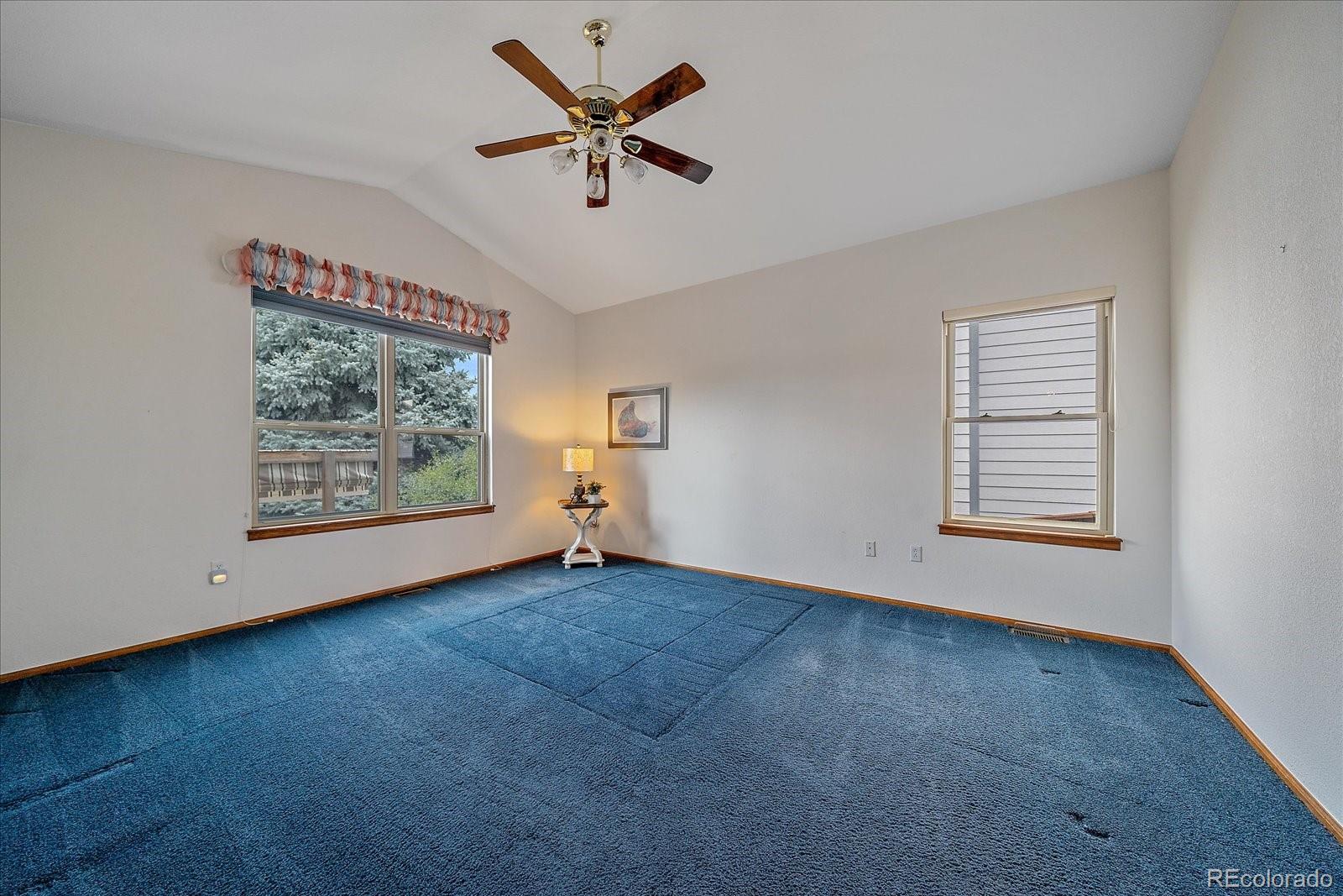 9875 Spring Hill Street Highlands Ranch, CO 80129 - Photo 17 of 38 an empty room with windows and fan