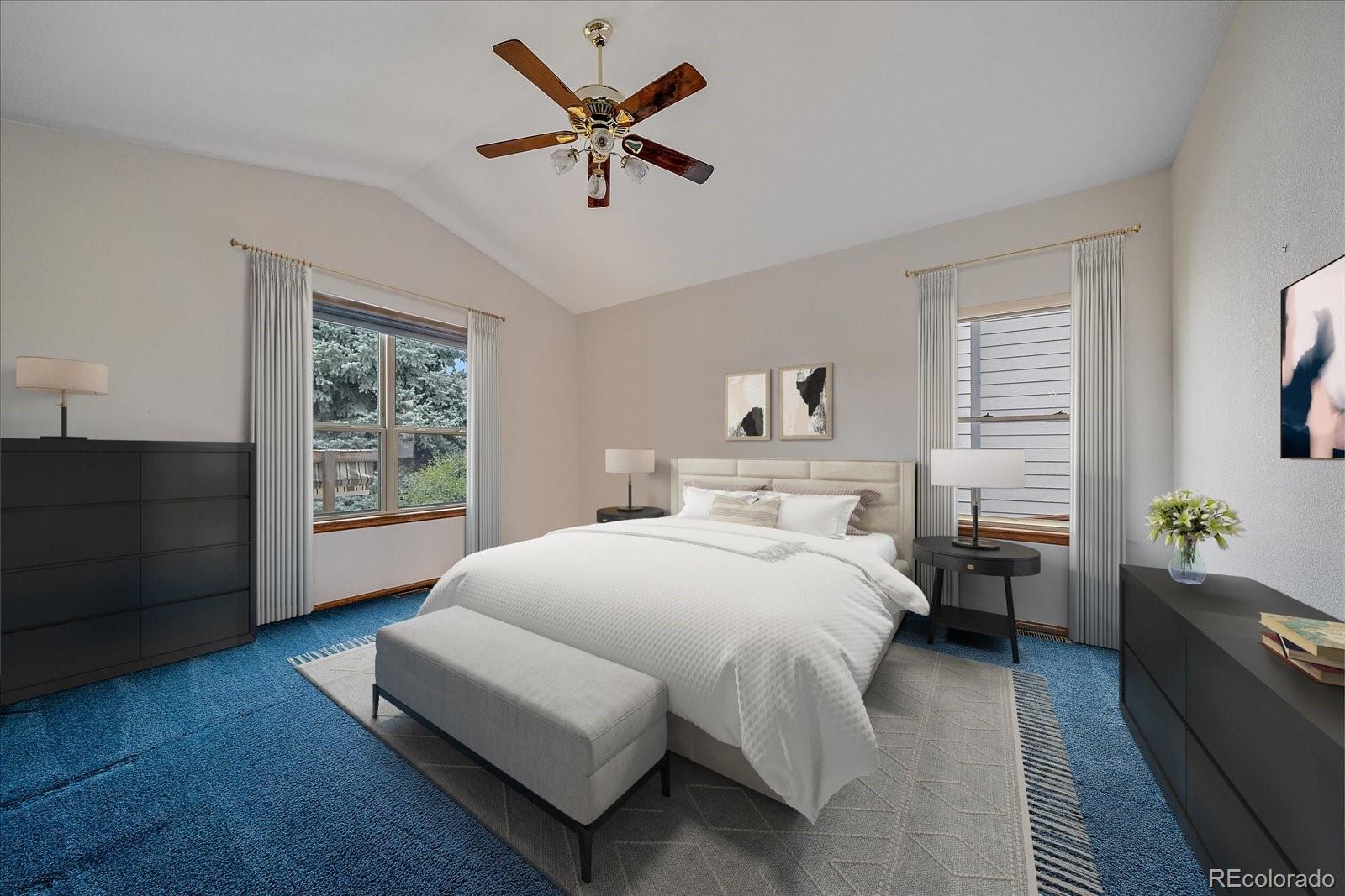 9875 Spring Hill Street Highlands Ranch, CO 80129 - Photo 18 of 38 a spacious bedroom with a bed a couch and a window