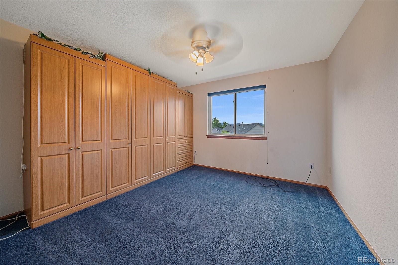 9875 Spring Hill Street Highlands Ranch, CO 80129 - Photo 27 of 38 a view of an empty room with a window