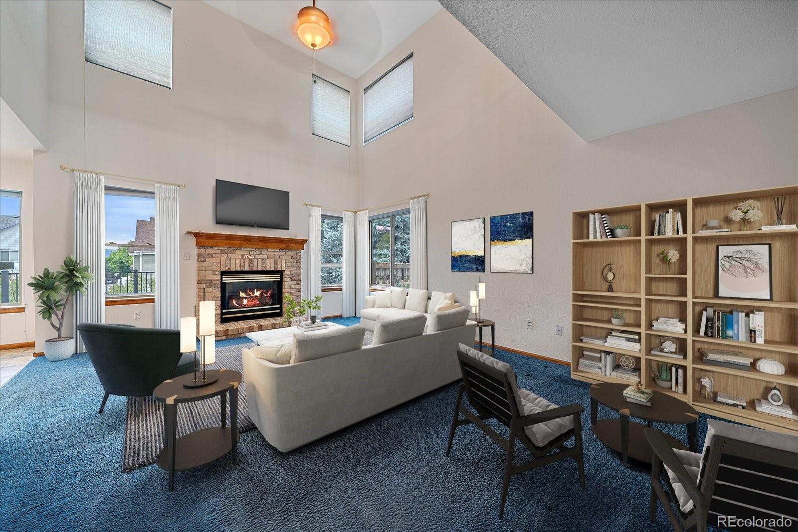 9875 Spring Hill Street Highlands Ranch, CO 80129 - Photo 9 of 38 a living room with furniture a fireplace and a flat screen tv