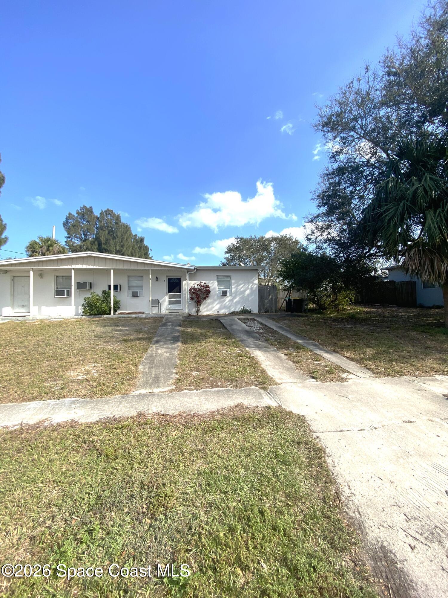 1199 Jordan Court Northeast, Unit B Palm Bay, FL 32905 - Photo 1 of 20 a view of a house with a yard